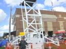 Captain Doug Hunter, KE8JNH, Wayne County Sheriff's Office, stands next to the SkyWatch tower at the Wayne County fair.